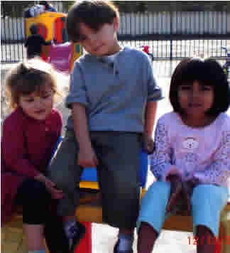 three kids on a bench